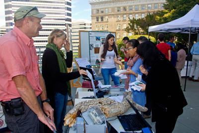 Acorn woodpecker granaries and oak research drew lots of visitors to the Hastings Natural History Reservation table, where director Vince Voegeli (left) and his wife Sandy answered questions. 